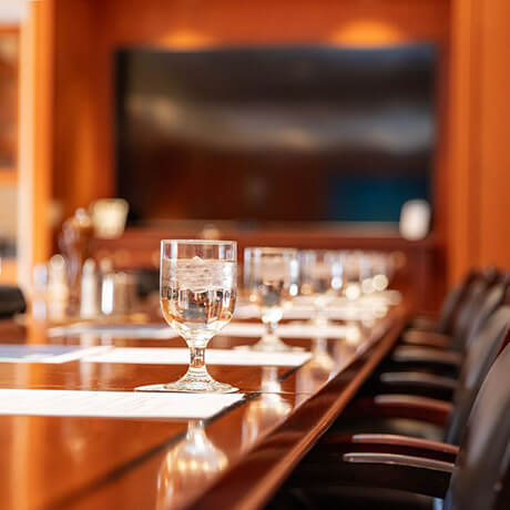 glass of water on board room table