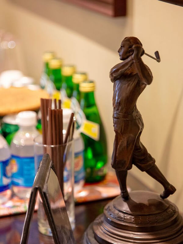 Figurine of woman golfing